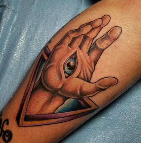 Cody Cook - eye hand abstract color tattoo
